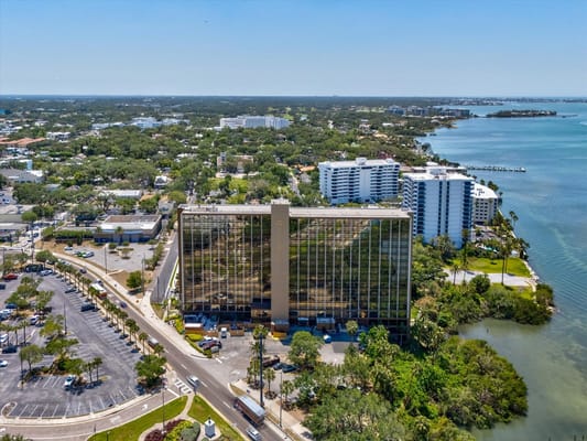 Aerial view of The Oaks of Clearwater facility by the water
