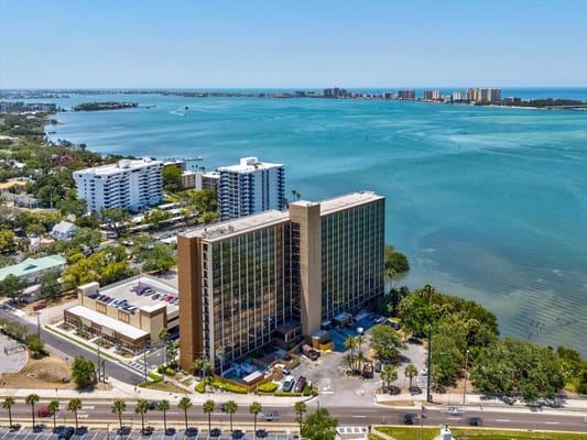 Aerial view of The Oaks of Clearwater building by the water