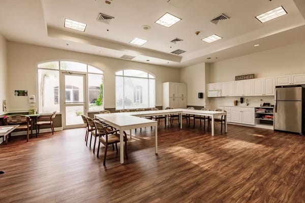 Bright common area with tables and chairs