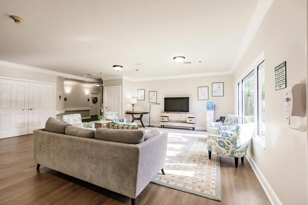 Bright common area with seating and television