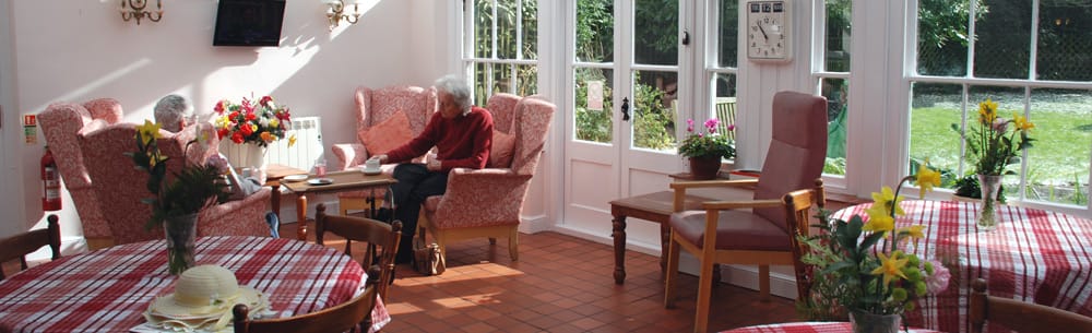 Residents enjoying a bright sunlit common area
