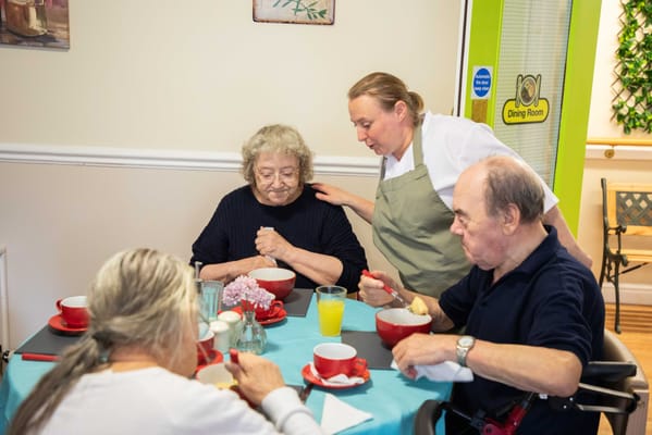 Residents enjoying a meal in the dining room