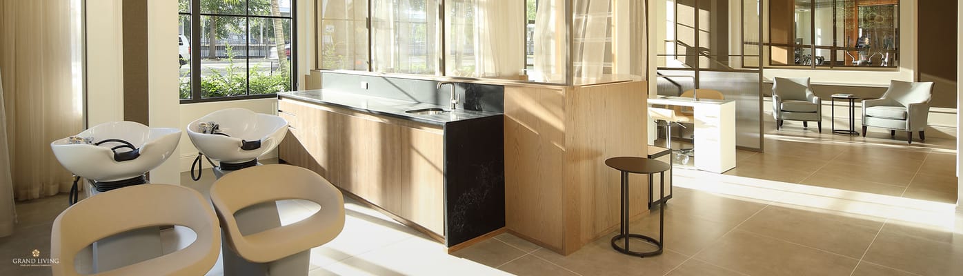 Interior of a hair salon area with chairs and sinks