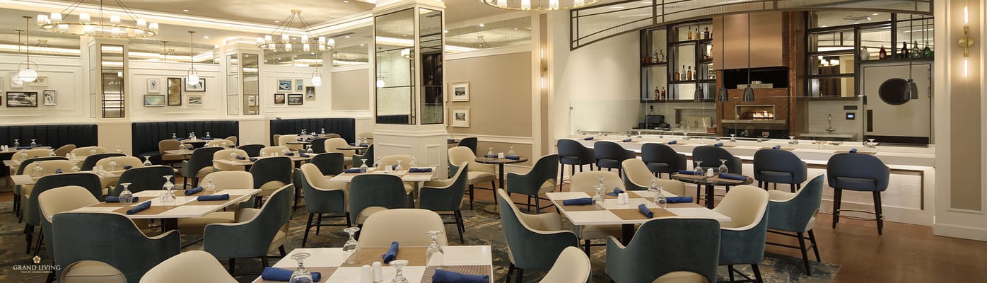 Elegant dining room with tables set for residents