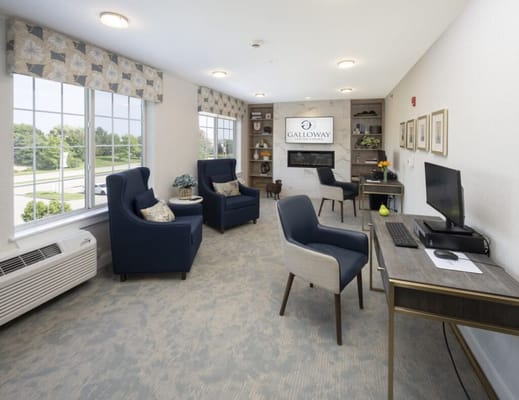 Common area with seating and a computer station