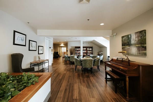 Bright common area with seating and bookshelves