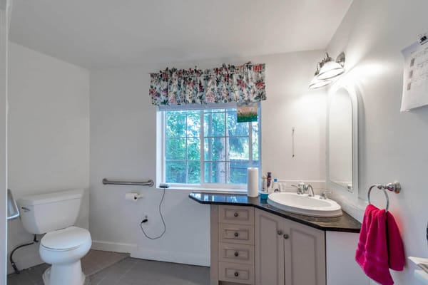 Bright bathroom with window and sink