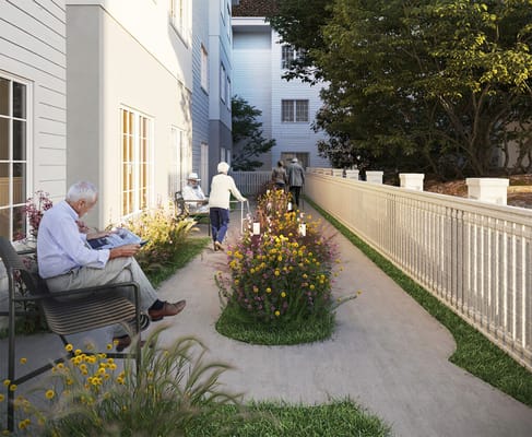 Residents enjoying a garden pathway with flowers