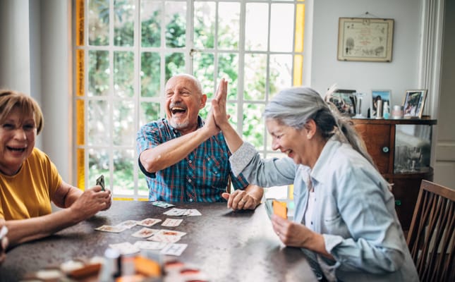Residents enjoying a game and smiling together