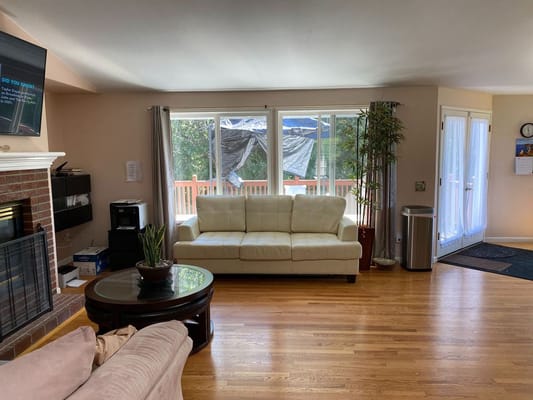 Cozy common area with a sofa and fireplace