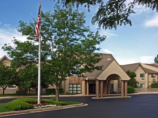 Exterior view of a senior care facility with landscaping