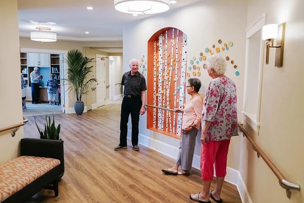 Residents interacting in a hall with decor