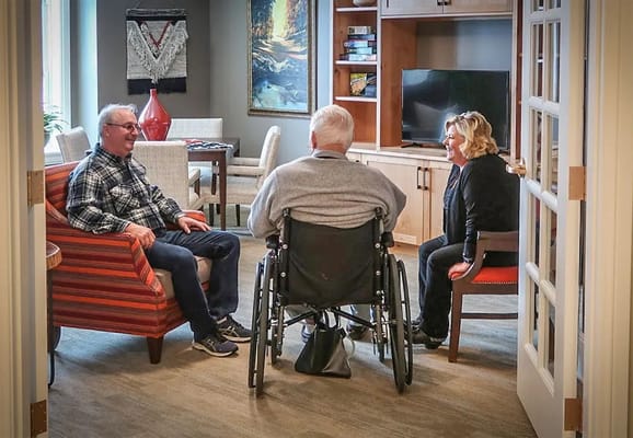 Residents and staff engaging in a cozy common area
