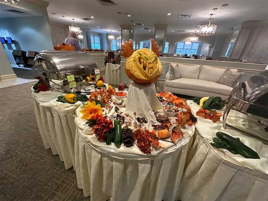 Residents enjoying a festive food display in a common area