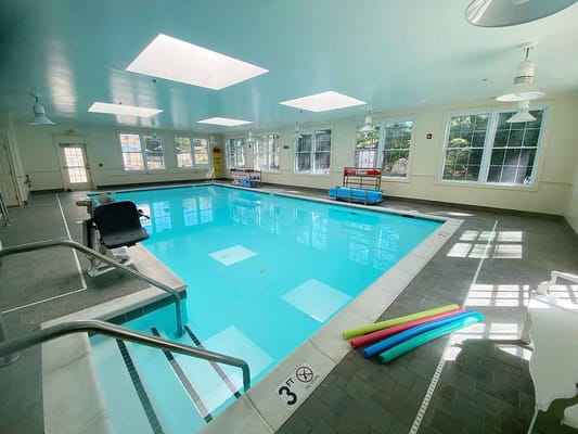 Indoor swimming pool with bright lighting