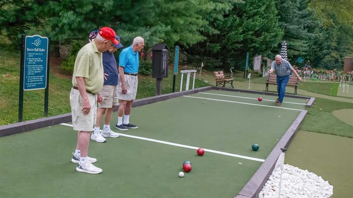 Residents playing bocce in an outdoor space