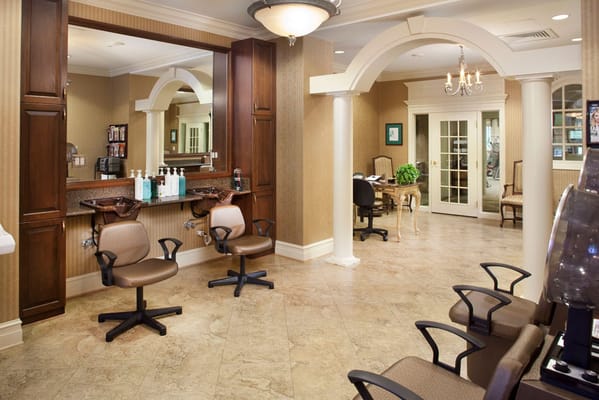 Interior view of a salon area with styling chairs