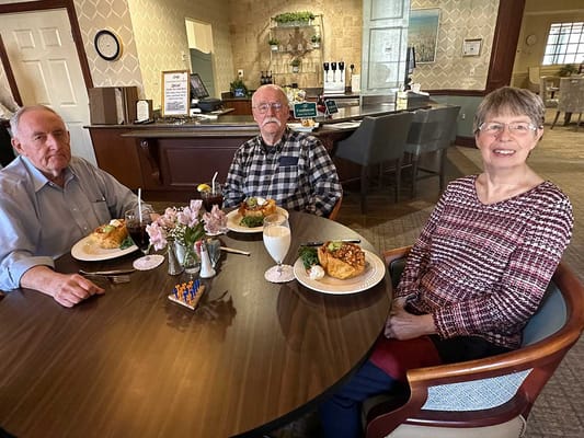 Residents enjoying meals in the dining area