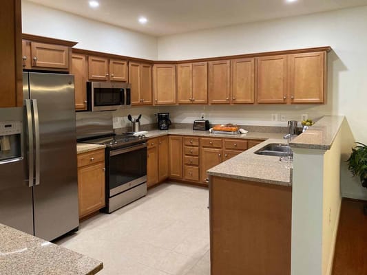 Modern kitchen interior with wooden cabinets and appliances