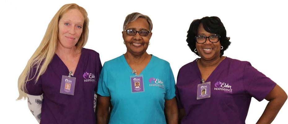 Staff members smiling in colorful uniforms