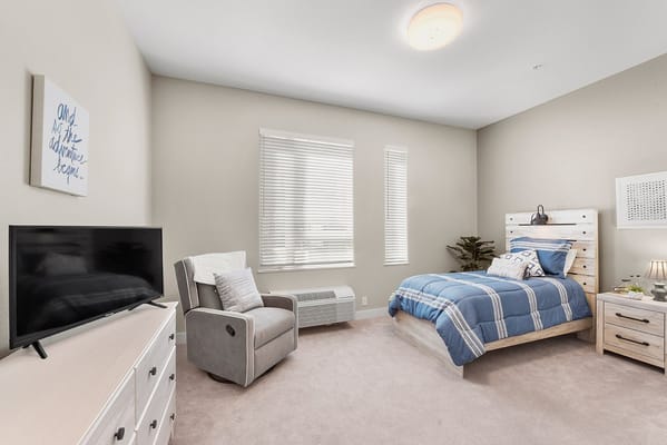 Cozy private resident room with furniture and decor