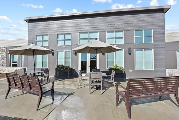 Outdoor seating area with umbrellas and benches