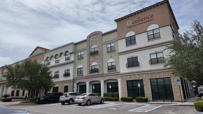 Exterior view of Excellence Senior Living facility in Orlando, FL.