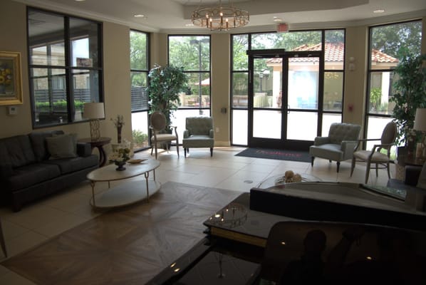 Elegant lobby area with seating and natural light