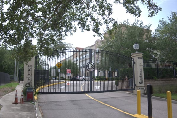 Entrance gate with logo at Excellence Senior Living