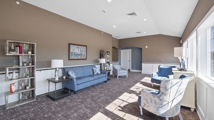 A bright common area with seating and decor