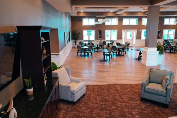 View of the common area with seating and dining tables