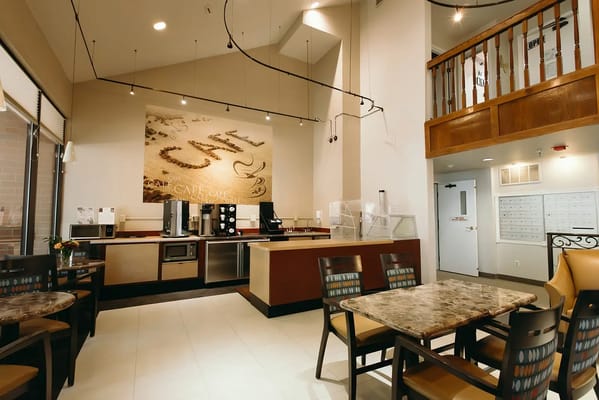 Interior view of a dining area with tables and chairs