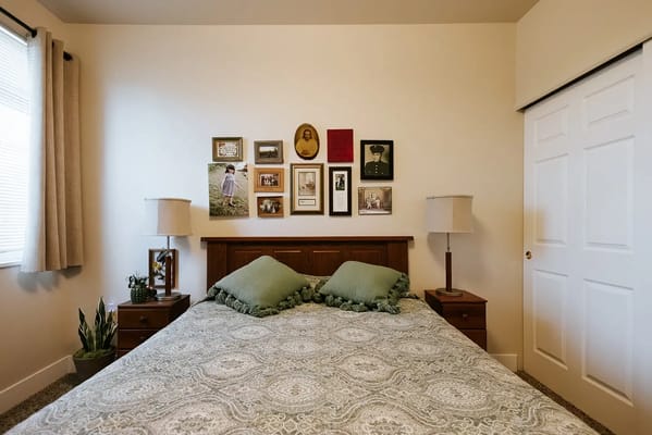 Cozy bedroom with framed photos on the wall