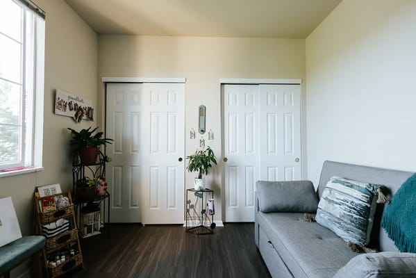 Cozy resident room with light-colored walls and plants