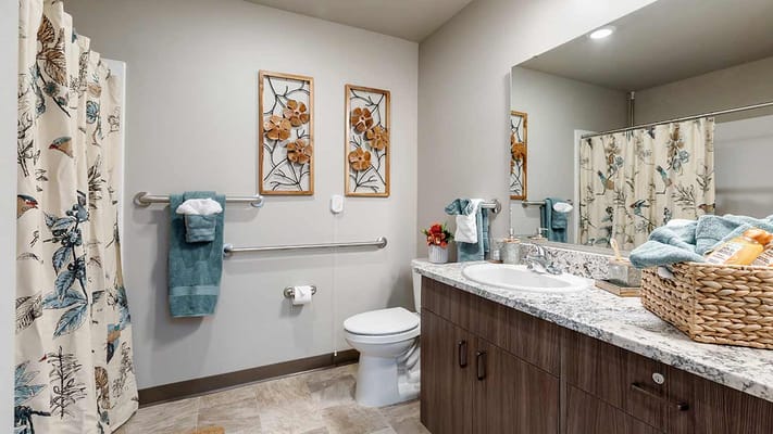 Modern bathroom with accessible features and floral decor