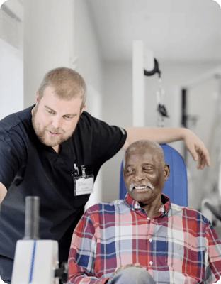 Staff member assisting a resident during therapy