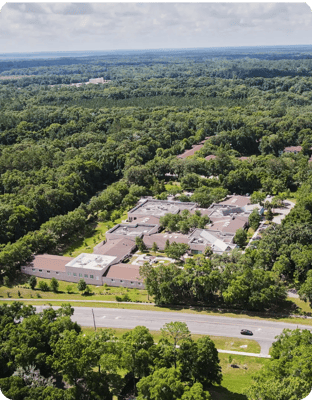 Aerial view of the health and rehabilitation center surrounded by forest