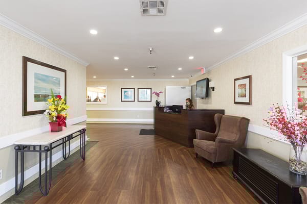 Lobby area with reception desk and floral decorations