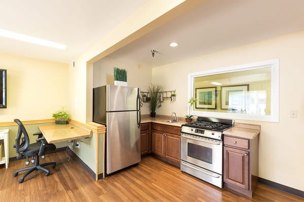 Modern kitchen area with appliances in a facility