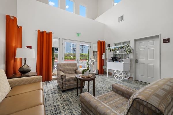 Bright interior common area with seating and decor