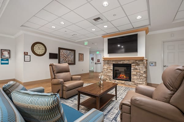 Common area with seating and a fireplace