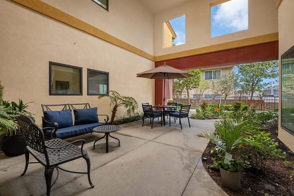 Outdoor patio seating area with plants