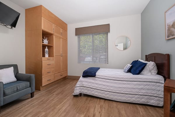 Bright and inviting resident room with furniture