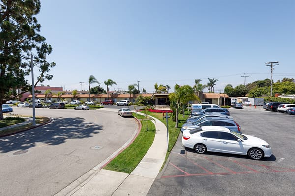 Exterior view of the nursing home facility with parking lot