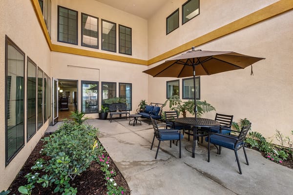 Patio area with seating and umbrella