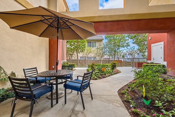 Outdoor seating area with tables and plants
