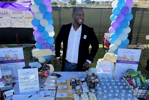 Vendor booth at a community event with snacks and water
