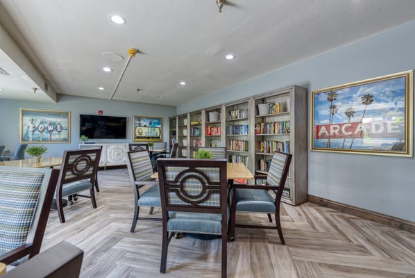 Bright common area with bookshelves and seating