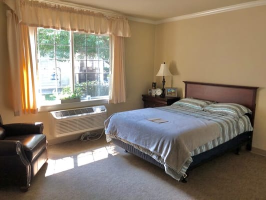 Cozy private resident room with a bed and window