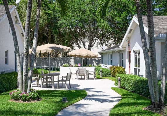 Outdoor seating area with tables and umbrellas